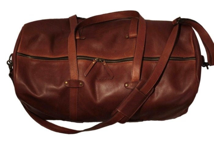 Profile perspective highlighting the leather texture and stitchwork of the Duffel Bag